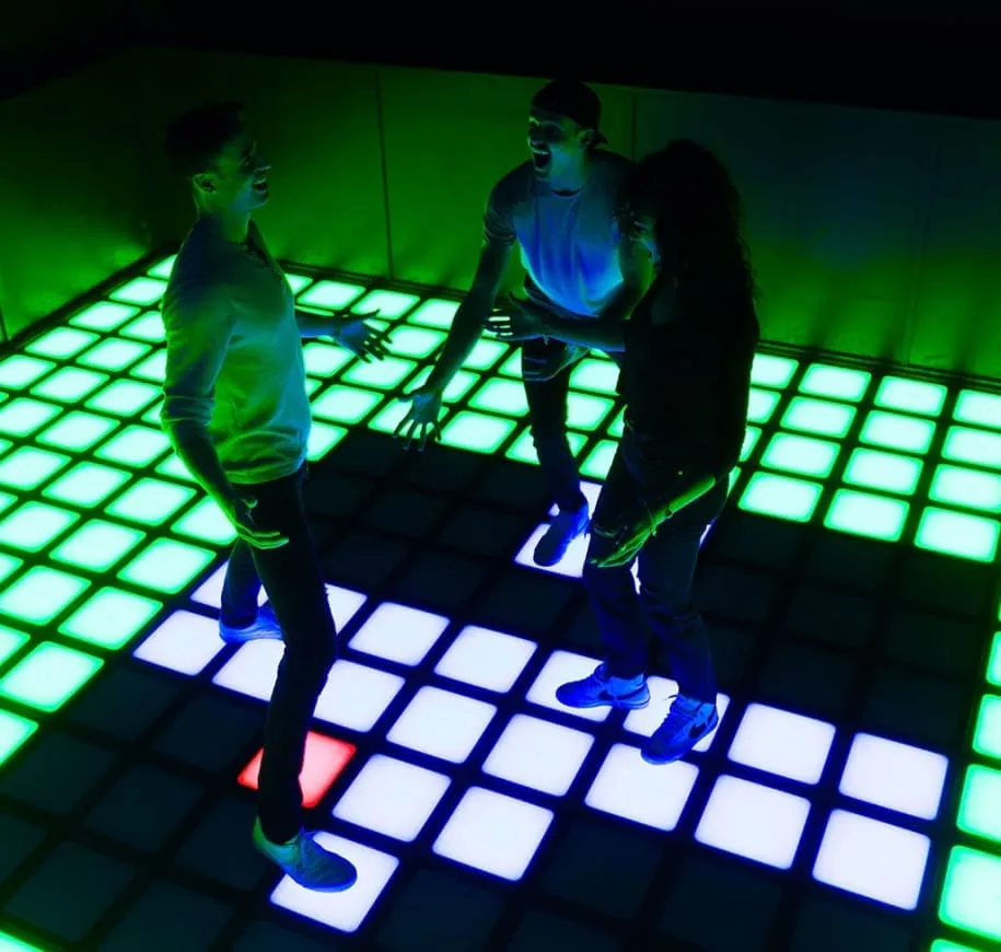 Group playing on Pixel interactive floor game